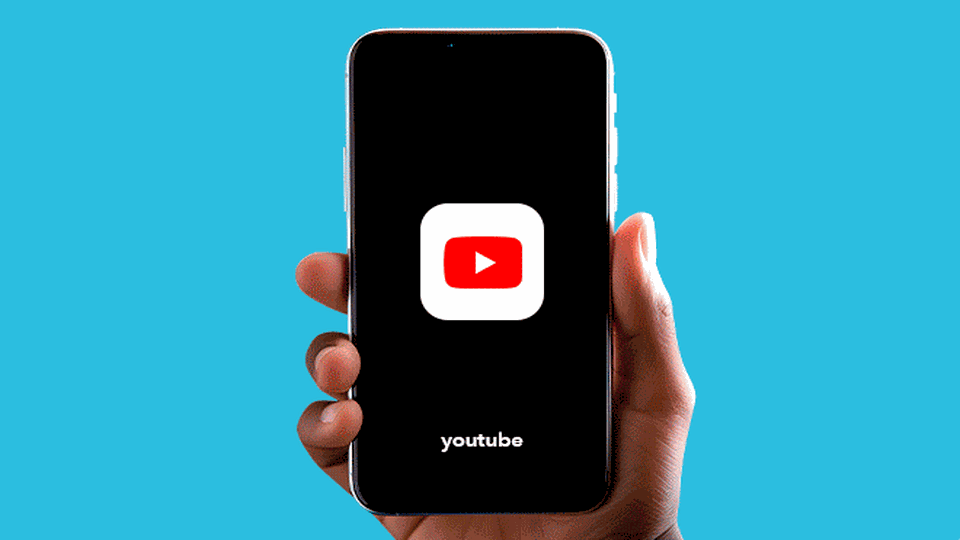 youtube on a phone in a persons hand
